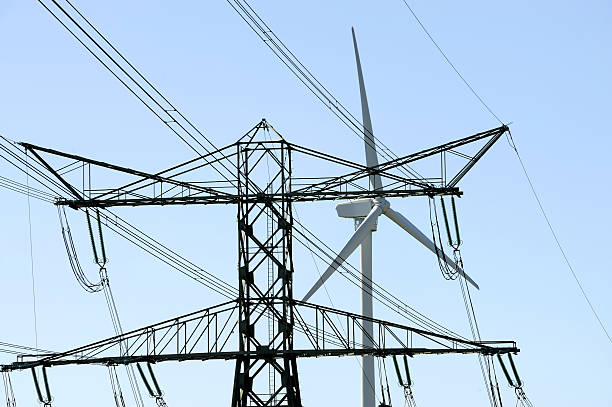 istock Power pylon and wind turbine 148225480