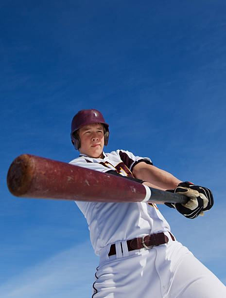 Spring training A baseball player taking a swing during spring training baseball hitter stock pictures, royalty-free photos & images