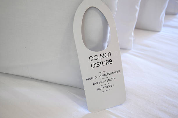 istock A new do not disturb sign against clean white pillows 148225725