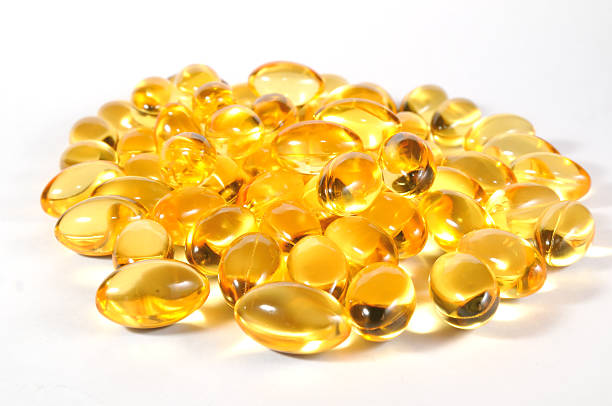 fish oil capsules stock photo