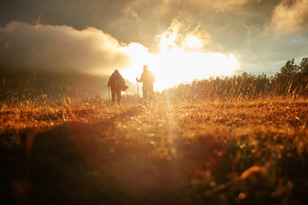 istock Couple hiking in mountains at dawn. 1482260706