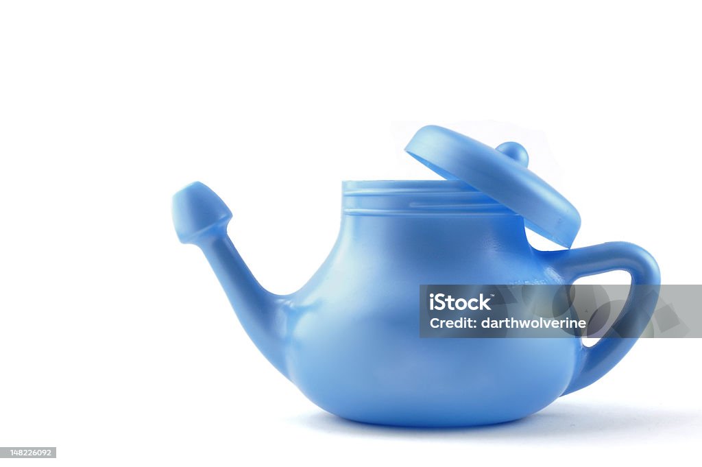 Modern Neti Pot Plastics A modern plastic Neti Pot, used for nasal irrigation, a homeopathic remedy for sinus relief. Nasal irrigation has been practiced in India for centuries as one of the disciplines of yoga. Washing Stock Photo