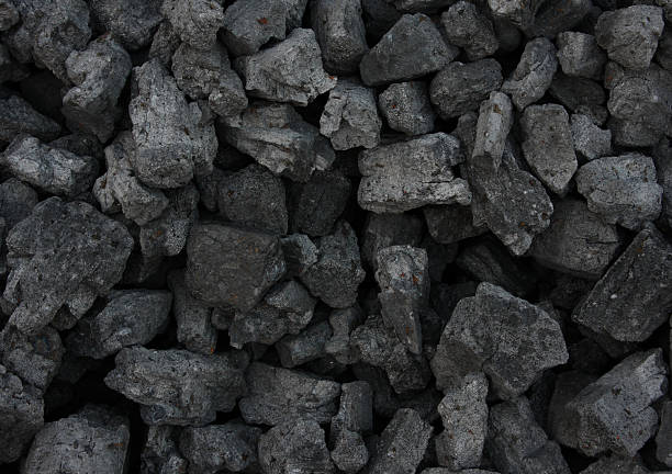 coal Pile of coal texture/background coke coal stock pictures, royalty-free photos & images