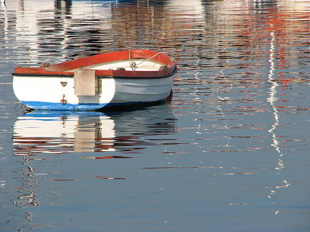 istock little boat in the reflections. 148226280
