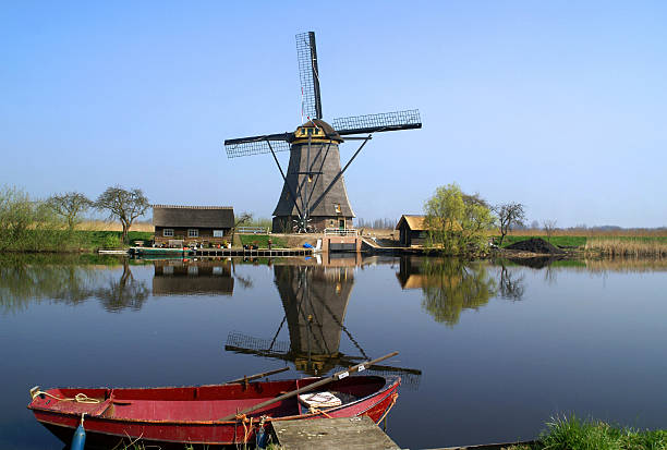 istock Boat  in front of historical  windmill 148227004