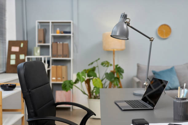 istock Home office workplace with laptop and chair 1482270098