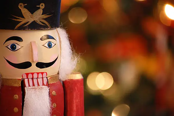 Nutcracker with holiday lighting background