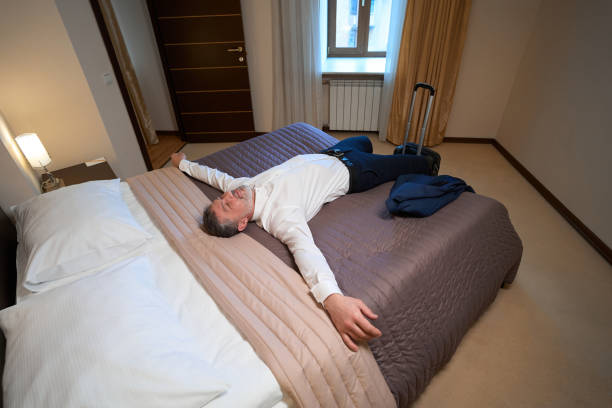 istock Man sleeping on sofa in the hostel, business trip 1482270914