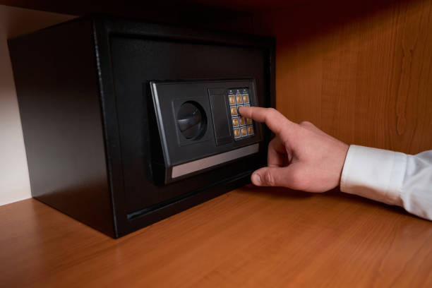 istock Male in shirt using safe in the hotel 1482270952