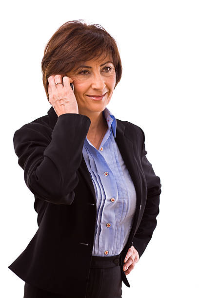 Senior businesswoman calling on phone stock photo