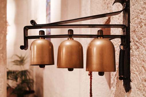 A majestic bell adorning the church spire, creating a harmonious blend of architecture and melody