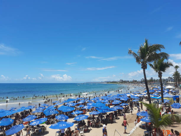 Salvador, BA, Brazil - January 01, 2023: Crowd crowds the beach on a sunny summer day on January 1st holiday