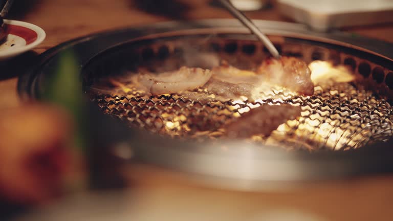 Close up beef grilled in Japan restaurant. Cooking barbecue grilled on stove .