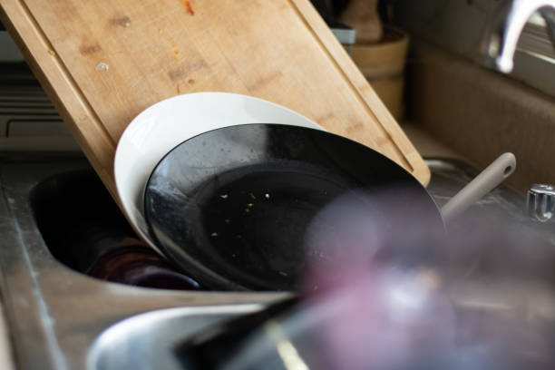 istock A sink with many dirt dishes in a common house 1482282015