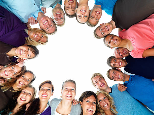 istock Happy young men and women standing together 148228376