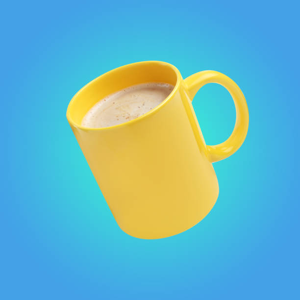 istock Yellow cup of coffee drink levitating on light blue background 1482284716