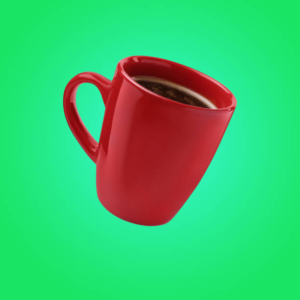 istock Red cup of coffee levitating on green background 1482284717