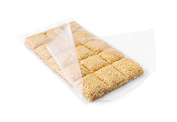 istock Unwrapped delicious sesame kozinaki bar isolated on white 1482284732