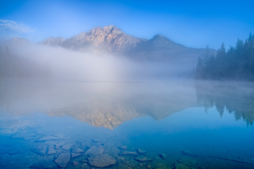 Pyramid Lake with fog in Jasper National Park