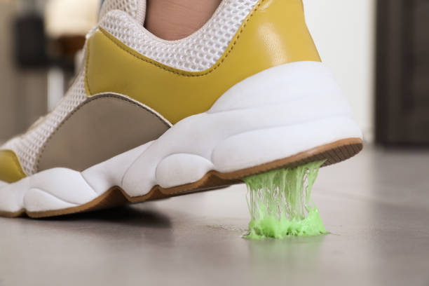 istock Person stepping into chewing gum on floor, closeup 1482286019