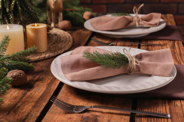 istock Festive place setting with beautiful dishware, cutlery and fabric napkin for Christmas dinner on wooden table 1482286838
