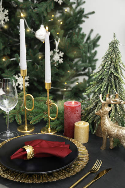 istock Festive place setting with beautiful dishware, cutlery and fabric napkin for Christmas dinner on grey table 1482286859