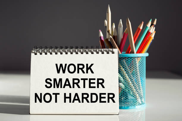 istock Work smarter not harder inscription on a notebook with colored pencils. Business concept 1482290132