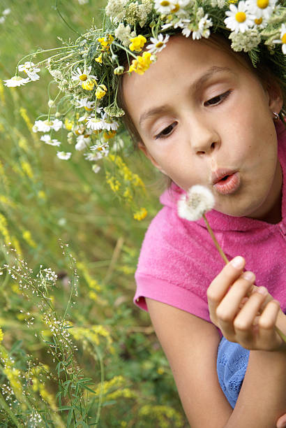 istock Girl with dandelion 148229014