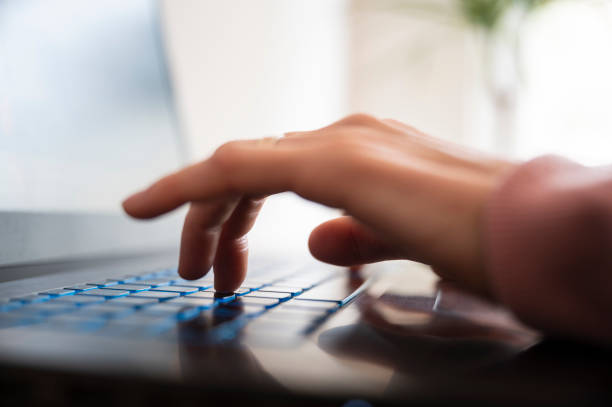 istock Closeup view of female hands using and typing on laptop computer 1482290739