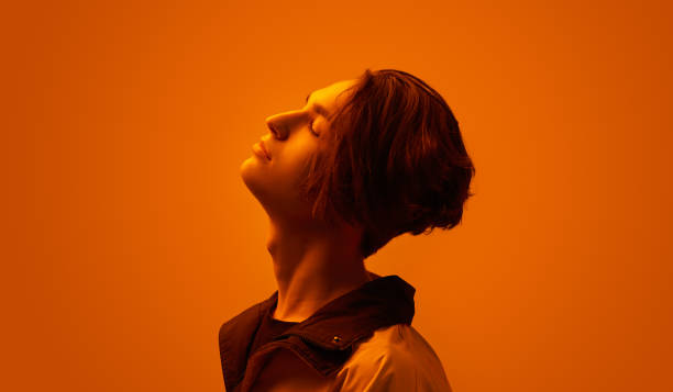 istock Dreamy young guy in studio with neon illumination 1482291126