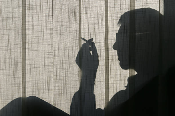 shadow of hands reaching for each other.