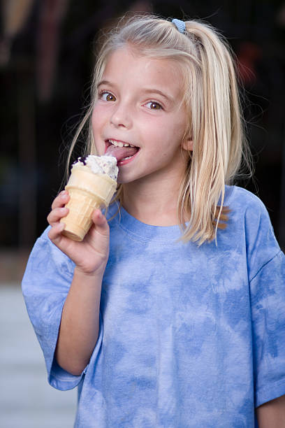 istock girl eating an ice cream cone 148229446