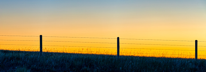Sunrise in hay field in rural Alberta, Canada