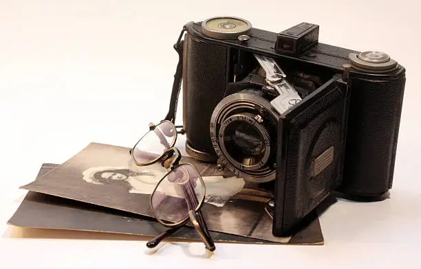 old photocamera, old photos and old glasses; We should remember