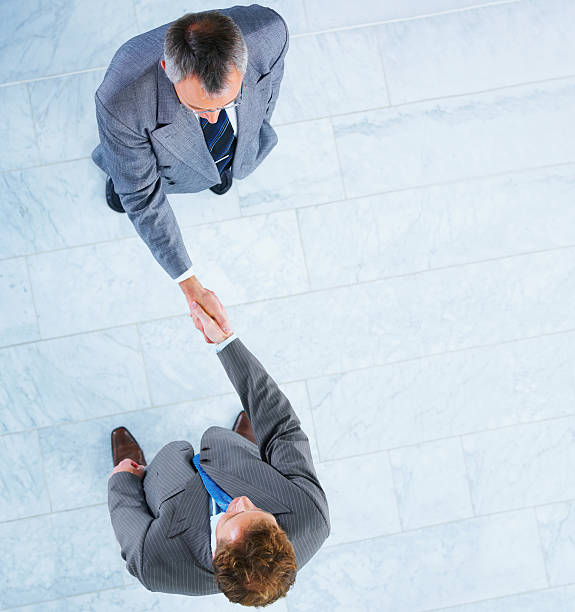 istock Business colleagues shaking hands in office 148229986