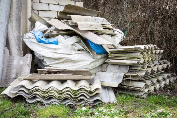 Photo of Roofing slate in a pile. Asbestos, harmful to humans and the environment