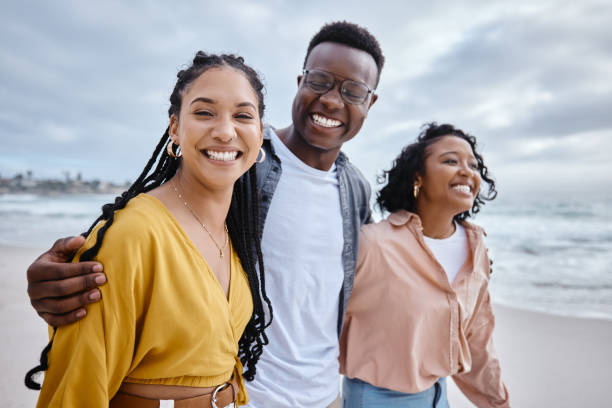 istock Beach, diversity and friends on a walk while on a vacation or weekend trip for summer in Hawaii. Travel, multiracial and happy people walking in nature by the ocean while on seaside holiday together. 1482301455