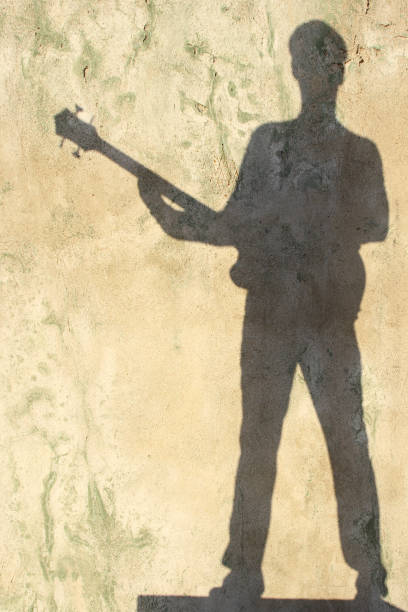 istock Shadow of a men with guitar. 148230284