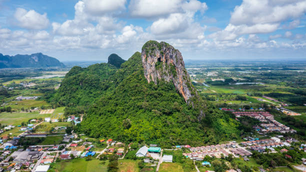 cityscape with Mountain of Phatthalung city, view from above in sunny day . Aerial view panorama of Khao Ok Thalu ,Phatthalung, Thailand. cityscape with Mountain of Phatthalung city, view from above in sunny day . Aerial view panorama of Khao Ok Thalu ,Phatthalung, Thailand. phatthalung province stock pictures, royalty-free photos & images