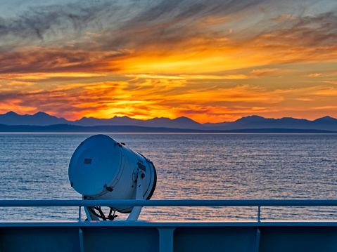 Searchlight on a ferry deck crossing over to  Vancouver Island at sunset in the province of British Columbia, Canada