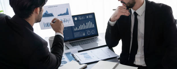 istock Busy analyst team discussing financial data on laptop. Fervent 1482312193