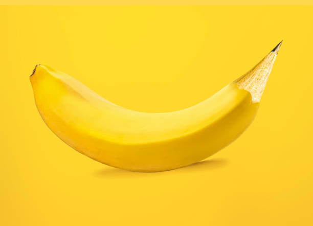 istock Banana-pencil merge creative concept on yellow background 1482314618