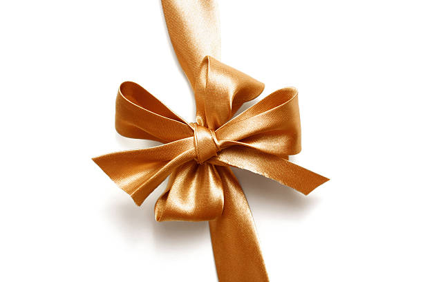 istock Big gold holiday bow on white background 148232170