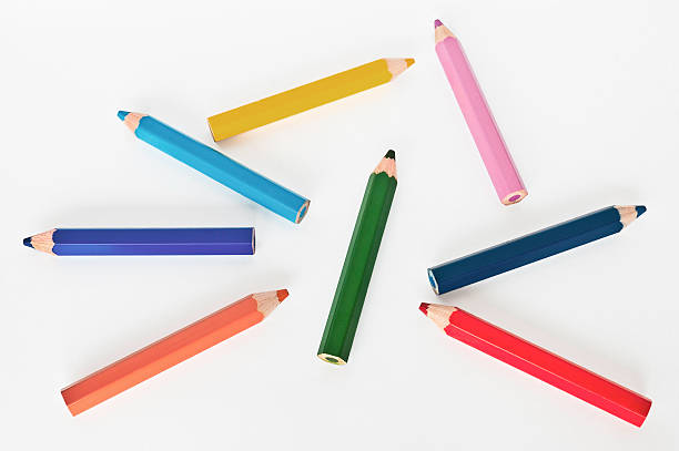 Small colored pencils on white background stock photo