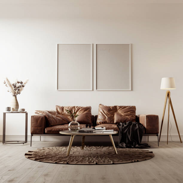 istock Picture frame interior set in empty room with sofa, lamp and center table. 3D render .White living room interior with lather sofa, wooden floor, 2 frame on a large wall, white lands 1482326469