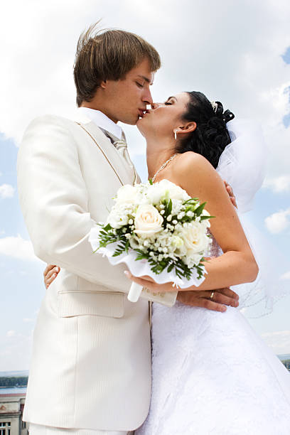 istock Bride and groom kissing 148232682