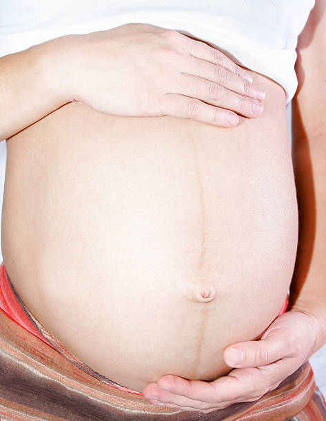 istock pregnant woman holding her belly 148232704