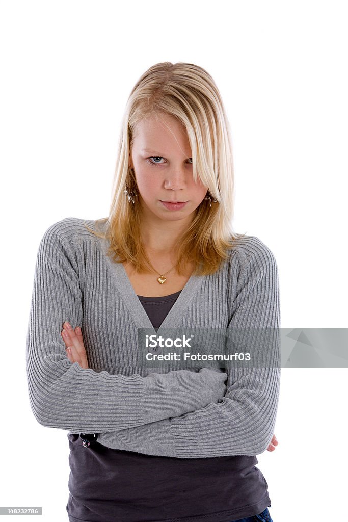 Stubborn teen Pretty blond teenager with her arms crossed looking stubborn 14-15 Years Stock Photo