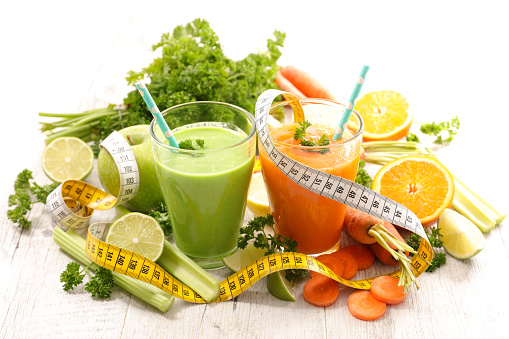 healthy lifestyle- vegetable smoothie or juice with fresh vegetables ingredients