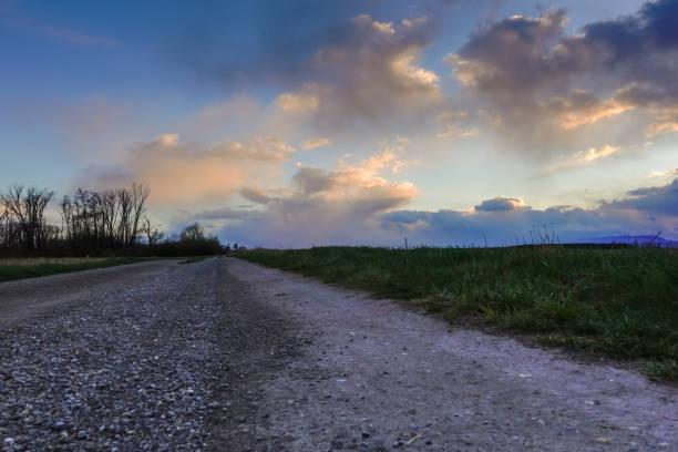 istock colorful clouds on blue with a dirt road sky after rain and storm 1482334983